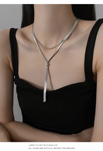 Detail of silver double-layered snake chain necklace with adjustable Y-shaped pendant drop