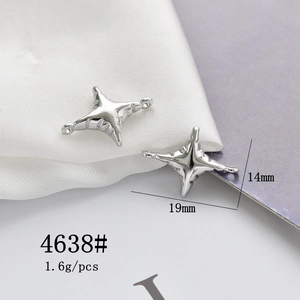 Macro shot of silver four-point star alloy charm with 19mm by 14mm size labels