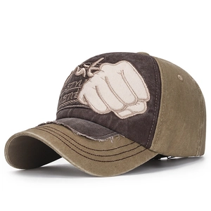 Close-up of vintage washed baseball cap featuring contrast stitching and embroidery