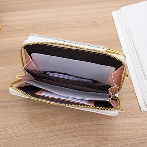 Open view of white sequin crossbody wallet showing card slots and zipper pocket