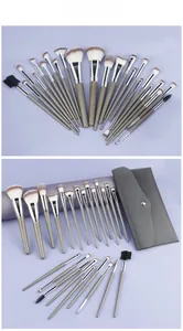 Macro display of 24pcs professional makeup brush set with gray handles and leather pouch