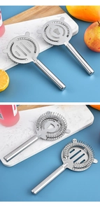 Dual-view close-up of stainless steel Hawthorne cocktail strainers on marble