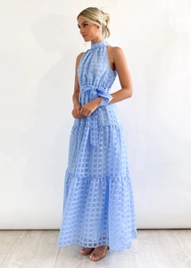 Detail of light blue plaid halter maxi dress with waist tie and tiered skirt design