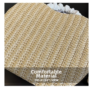 Macro view of woven straw texture with white pleated PU handle and metal lock