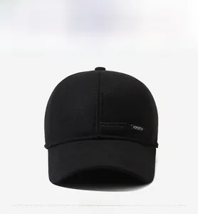 Detail of black baseball cap with sport metal badge and premium twill fabric texture