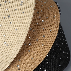 Macro view of woven sun hat textures with sparkling rhinestones in three colors