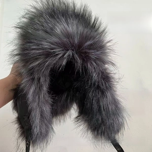 Detailed view of thick natural blue fox fur texture on a warm earflap aviator hat