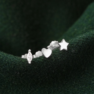 Macro detail of S925 sterling silver stud earring set with heart, star and marquise crystal