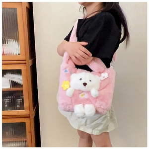 Detail of pink plush kids handbag with a cute 3D teddy bear and floral decor