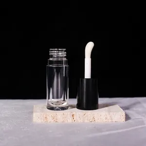 Detail of 6ml clear lip gloss tube featuring a black cap and large soft doe foot applicator
