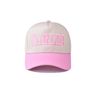 Close-up of pink DARLIN embroidery on a beige and pink cotton baseball cap detail