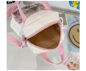 Top view of white and pink canvas crossbody bag showing zipper and brown interior lining