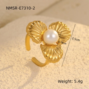 Detail shot of golden floral pearl ring on stone with 2.5cm size and 5.4g weight specs