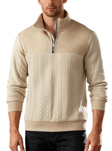 Detailed close-up of cable knit patterns and quarter-zip collar on men's beige sweater