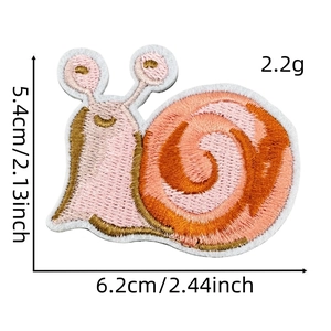 Detailed macro view of a pink snail embroidered patch with 6.2x5.4cm size specs