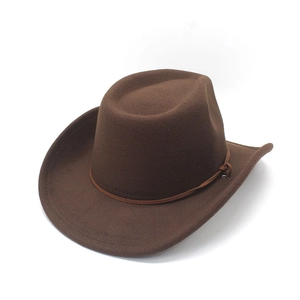 Close-up of brown felt western cowboy hat featuring side-curled brim and leather cord