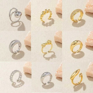 9-piece gold and silver stackable rings set featuring smooth, twisted, and rhinestone designs