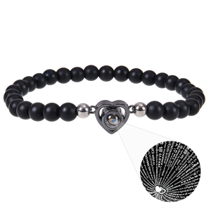 Detail of pink zebra stone bead bracelet with I Love You projection in 100 languages