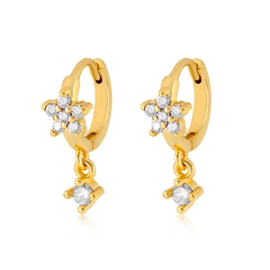 Macro shot of gold floral earrings featuring micro-set zircon and sparkling drop pendants