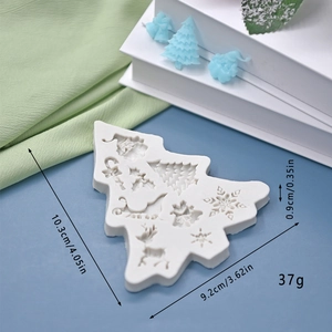 Close-up of Christmas silicone mold featuring reindeer and snowflake patterns for DIY cakes