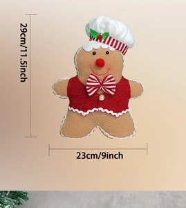 Detail of plush gingerbread chef doll showing 29cm height and 23cm width dimensions