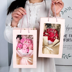 Detail of pink flower gift box with soap roses, LED lights, and eternal ribbon handle
