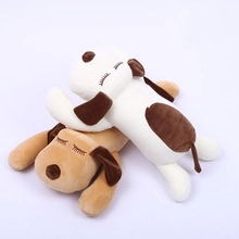 Detail of two plush teddy bears in brown and white colors in a sleeping position