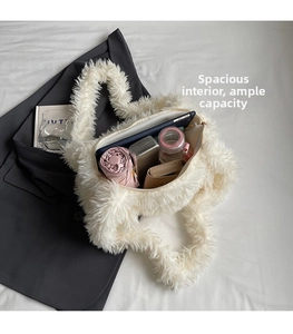 Spacious interior of white faux fur tote bag showing ample room for daily essentials