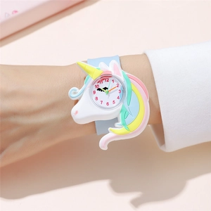 Detail shot of a 3D unicorn silicone watch showing the analog dial and colorful 3D textures