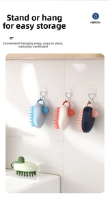 Scalp massage brush showing standing and hanging storage options for bathroom ventilation