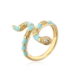 Detail of 18K gold snake ring featuring light blue enamel and sparkling cubic zirconia