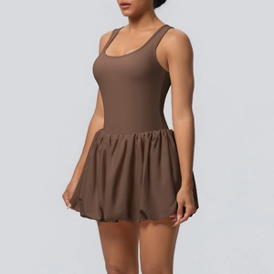 Detail view of the coffee brown backless tennis dress with pleated skirt and sleek fabric