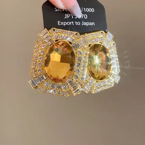 Vintage gold square stud earrings with amber faux stones and sparkling rhinestones