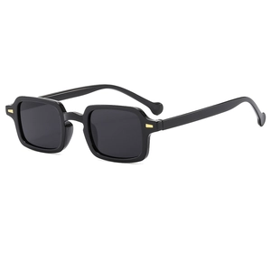 Vintage black square sunglasses with golden metal rivets and a polished resin frame