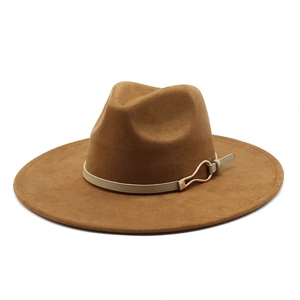 Detail of brown suede felt fedora featuring a beige leather band and golden buckle