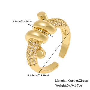 Detail view of gold-plated knot ring showing dimensions, 12mm width, copper and zircon