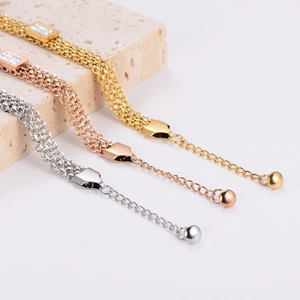 Three-layer stainless steel bracelets in gold, silver, and rose gold with bead charms
