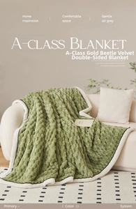 Detail of green flannel blanket with 3D bubble texture and soft white fleece border