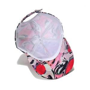 Detail view of baseball cap interior with abstract print and 100% polyester care label