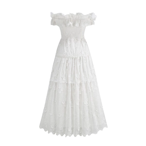 Detailed view of white off-shoulder lace dress with ruffles and elastic pleated waist