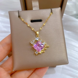 Golden titanium steel necklace featuring a large pink square zircon and crystal accents