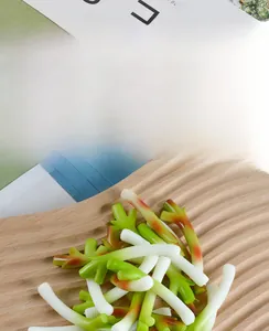Realistic miniature green onion keychain detail showing gradient resin texture on wood tray