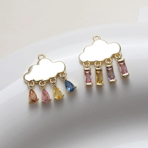 Detailed macro view of 14K gold plated cloud charms with colorful crystal raindrops