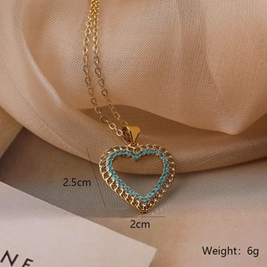 Macro shot of gold heart pendant necklace with dimensions 2.5cm by 2cm weighing 6g