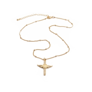 Detail of gold cross necklace with Virgin Mary relief and wings with zircons