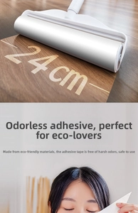 Detail of 24cm extra wide lint roller with replacement core on wooden floor