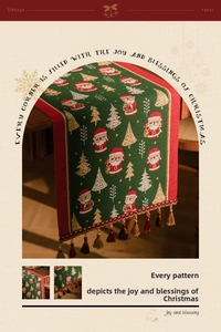 Detail of Christmas table runner with green jacquard fabric and festive fringe