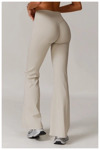Detail view of high-waist yoga flared pants with V-shape seam for lifting the hips