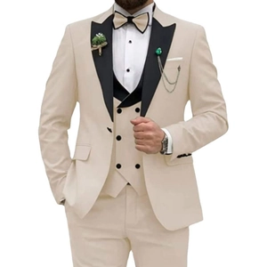 Men's ivory three-piece wedding suit with black peak lapel jacket, vest, and trousers
