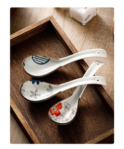Detailed top view of three Japanese ceramic soup spoons with blue and red floral patterns